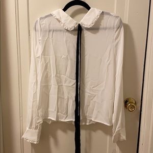 Color white blouse with a tie up bow